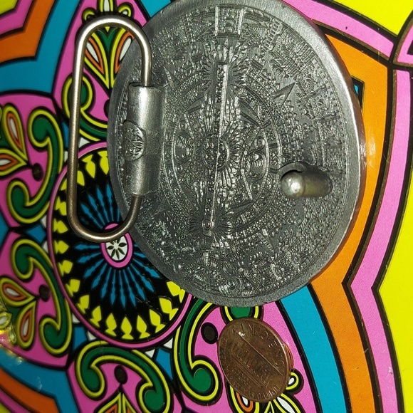 Aqua / emerald green Mayan calendar brass belt buckle by bergamot brass. 1974